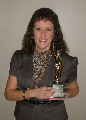 Lisa Gullette with MarCom Gold Award